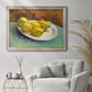Impressionist still life with lemons by Vincent van Gogh in an ornate champagne frame displayed in a bright interior setting.