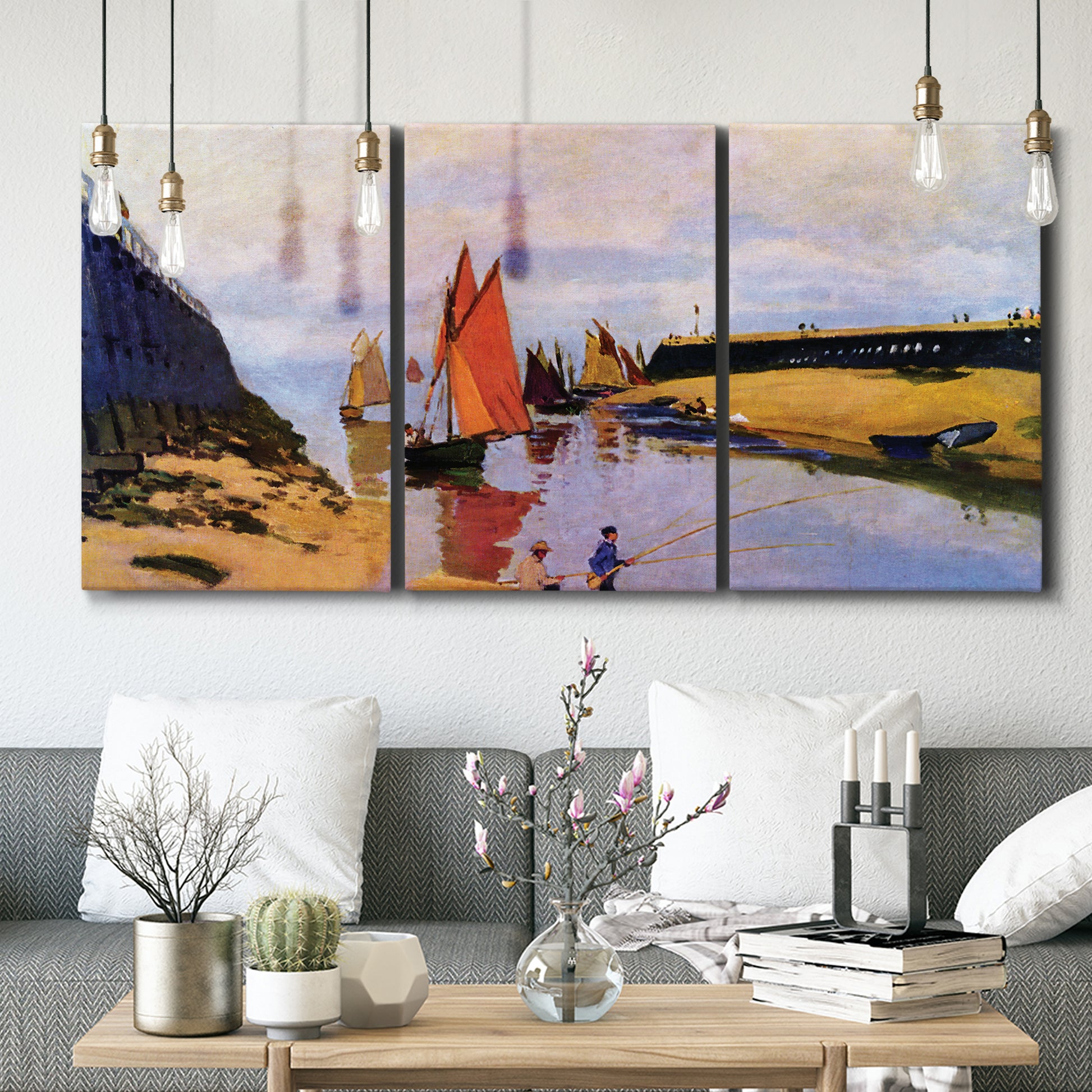 Three-panel canvas wall art featuring stone breakwater at low tide, displayed in a modern living room above seating.