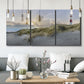 Three-panel canvas wall art featuring guardian boat along shoreline, displayed in a modern living room above seating.