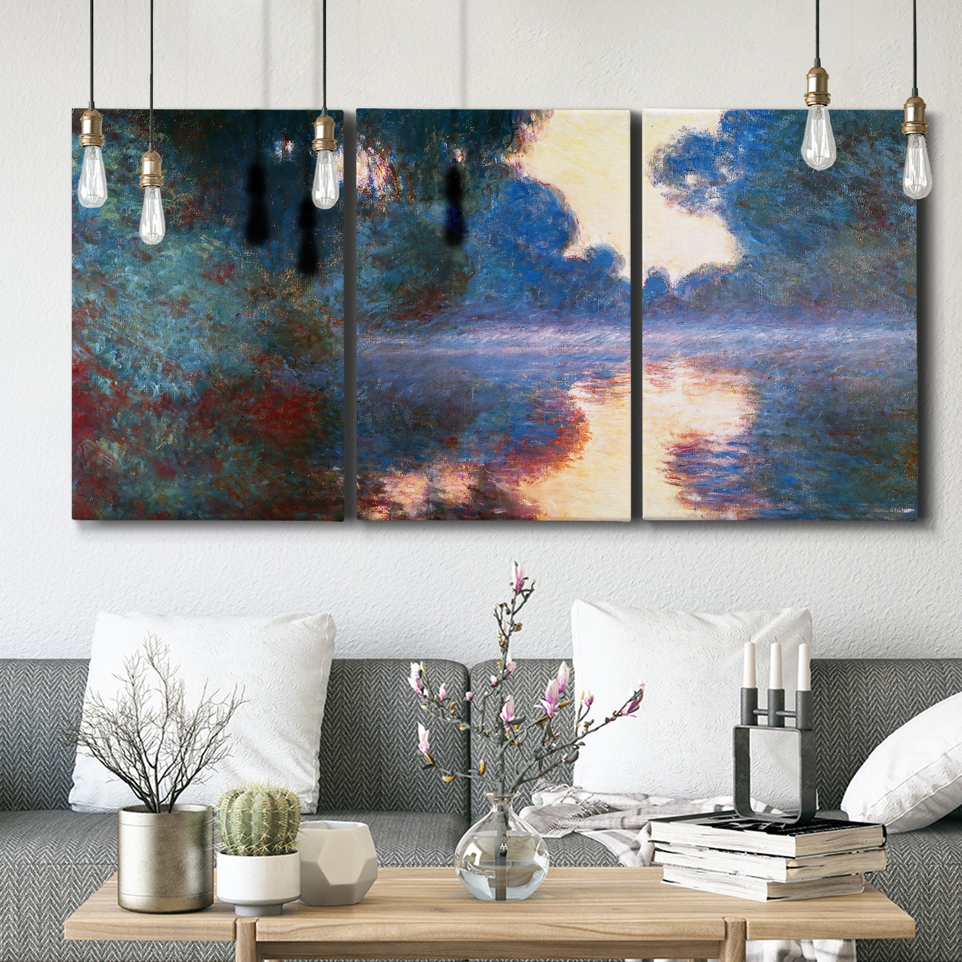 Three-panel canvas wall art featuring misty river surface at dawn, displayed in a modern living room above seating.
