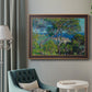 Impressionist Mediterranean coastal landscape by Claude Monet in an ornate bronzed mahogany wood frame displayed in a bright interior setting.