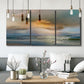 Three-panel canvas wall art featuring tranquil beach at sunset, displayed in a modern living room above seating.