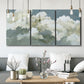 Three-panel canvas wall art featuring abstract evening landscape with depth, displayed in a modern living room above seating.