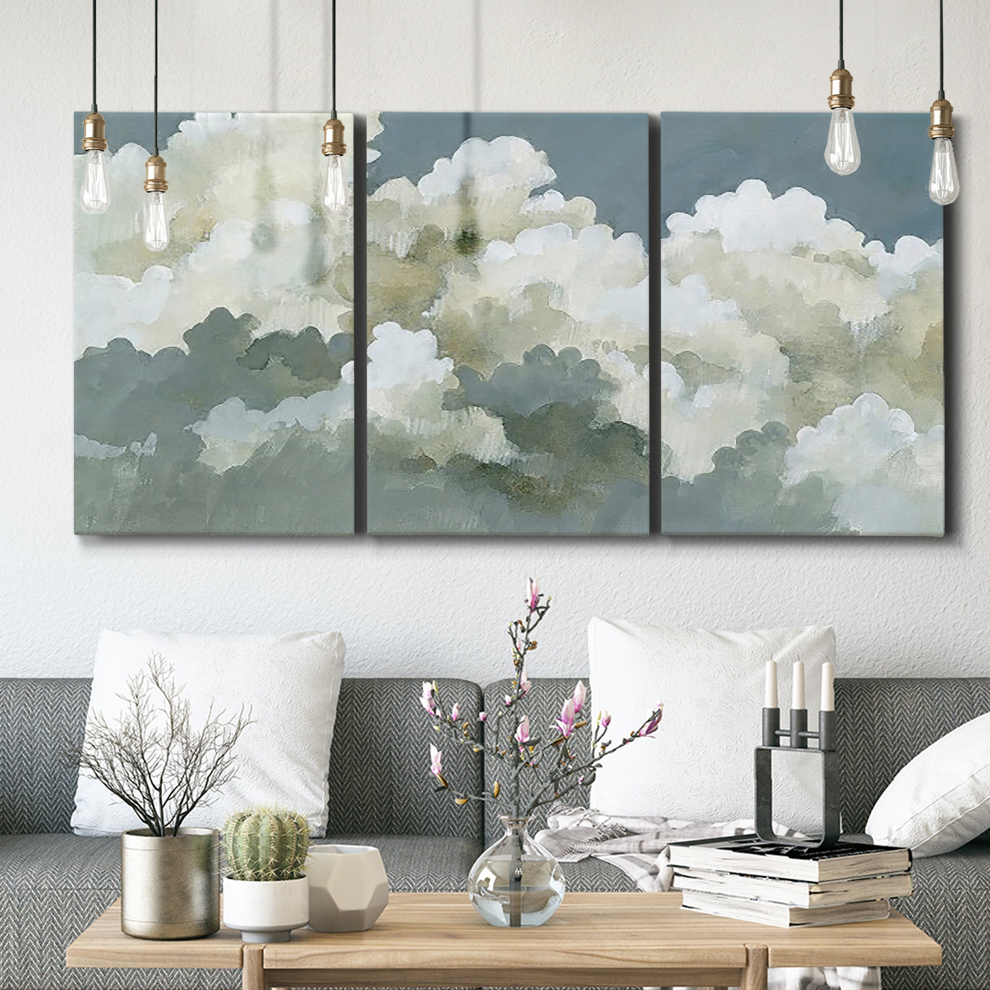 Three-panel canvas wall art featuring abstract evening landscape with depth, displayed in a modern living room above seating.