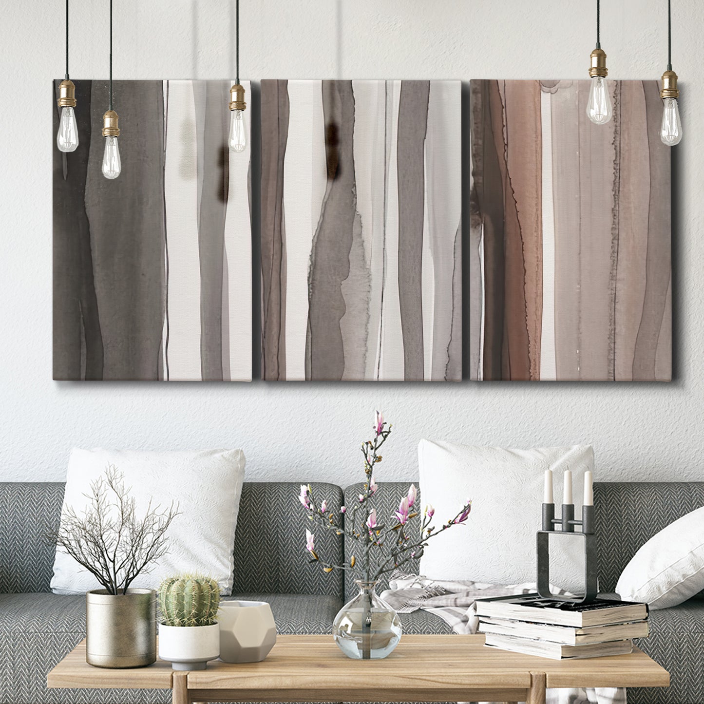 Three-panel canvas wall art featuring riverbank landscape with reflections, displayed in a modern living room above seating.