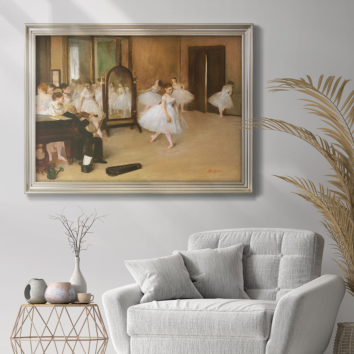 Impressionist dance class interior scene by Edgar Degas in an ornate champagne frame displayed in a bright interior setting.
