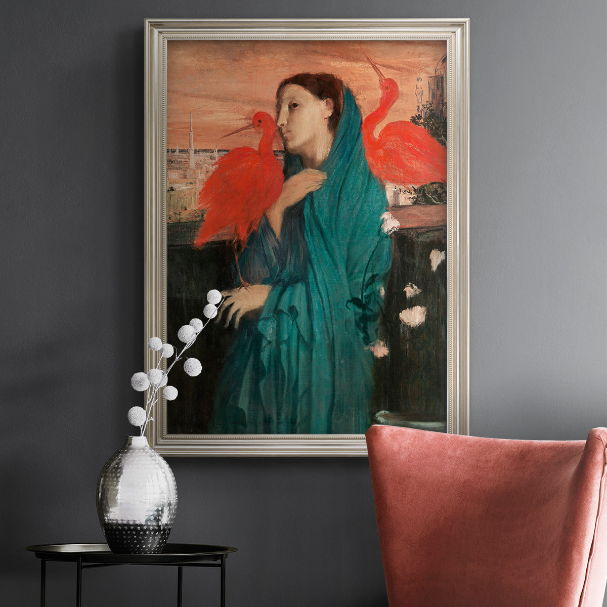 Impressionist portrait of a young woman with an ibis by Edgar Degas in an ornate champagne frame displayed in a dark-toned interior setting.