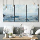 Three-panel canvas wall art featuring abstract sailboats on water, displayed in a modern living room above seating.