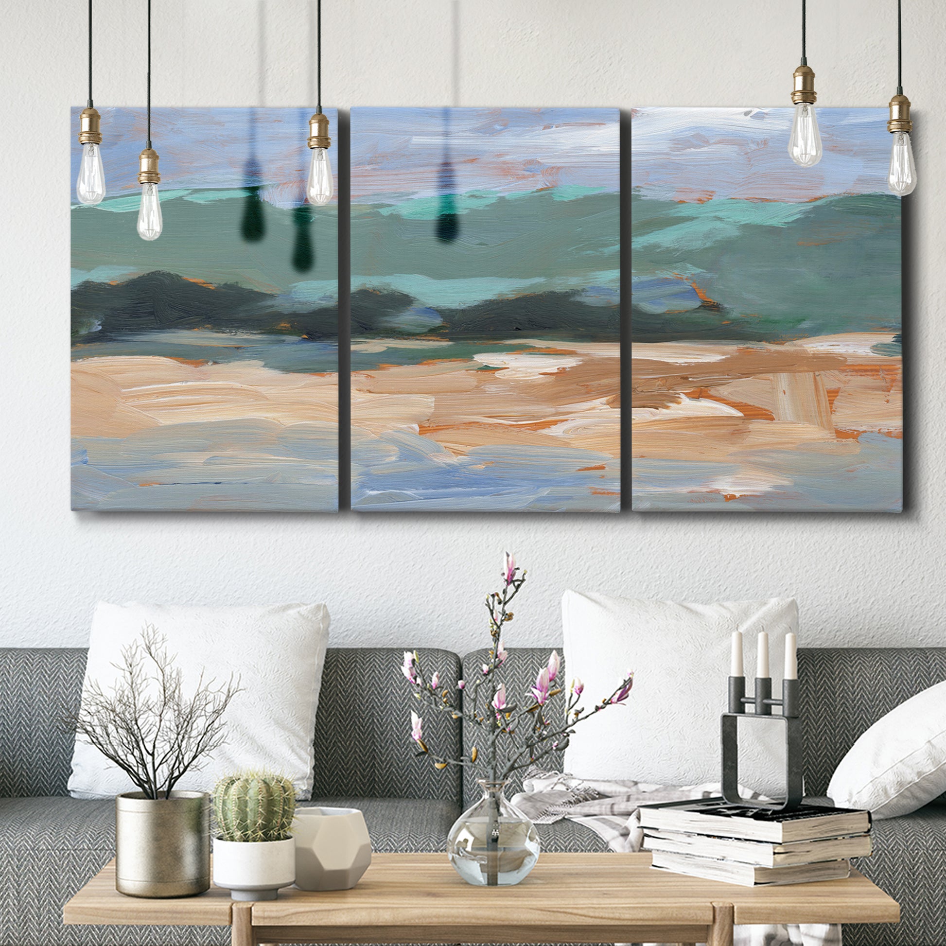 Three-panel canvas wall art featuring abstract landscape composition study, displayed in a modern living room above seating.