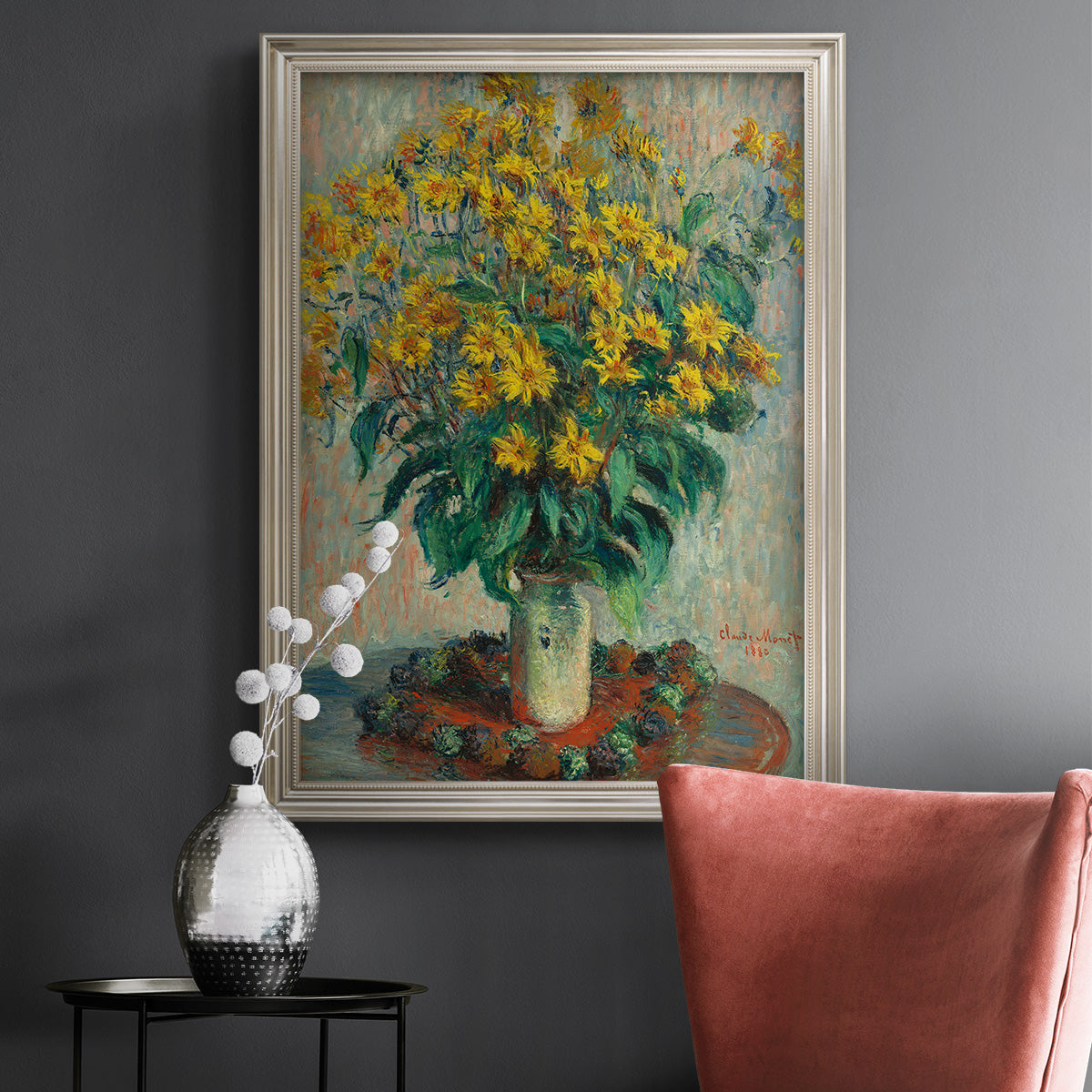 Impressionist floral painting of artichoke flowers by Claude Monet in an ornate champagne frame displayed in a dark-toned interior setting.