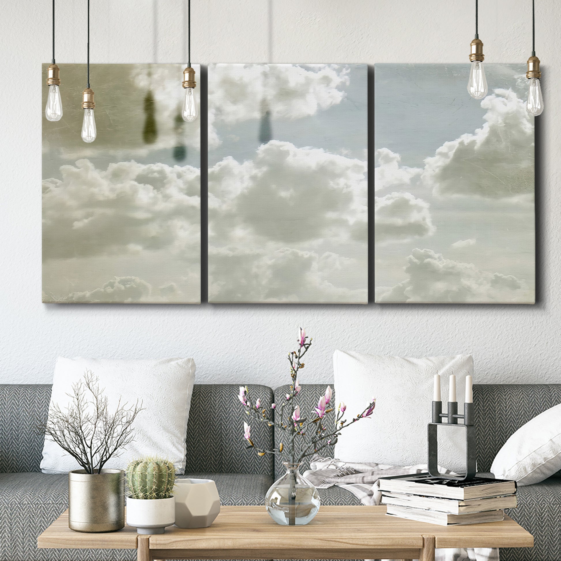 Three-panel canvas wall art featuring whimsical vertical tree landscape, displayed in a modern living room above seating.
