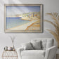 Impressionist Mediterranean jetty seascape by Paul Signac in an ornate champagne frame displayed in a bright interior setting.