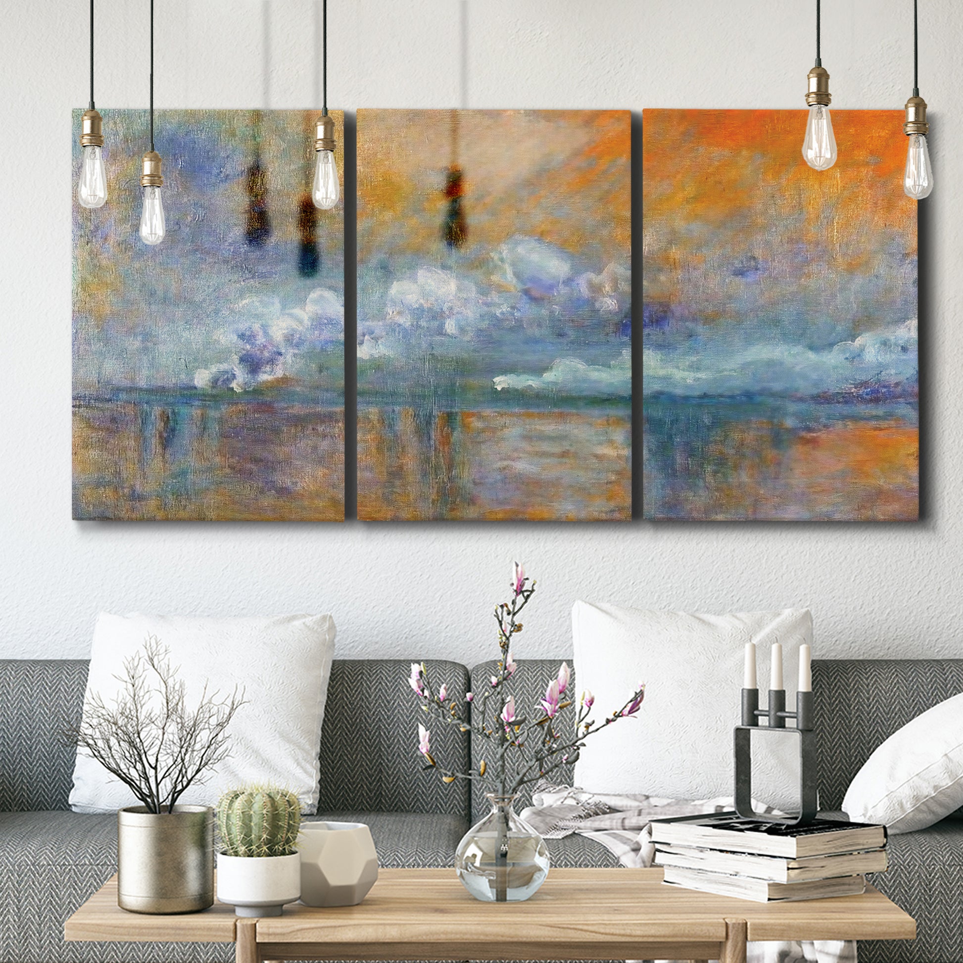 Three-panel canvas wall art featuring bridge shrouded in fog and smoke, displayed in a modern living room above seating.