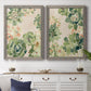 Set of two gray barnwood framed canvas prints depicting a coordinated art pair of dense repeating succulents and small flowers rendered as decorative botanical pattern prints above a dining room sideboard.