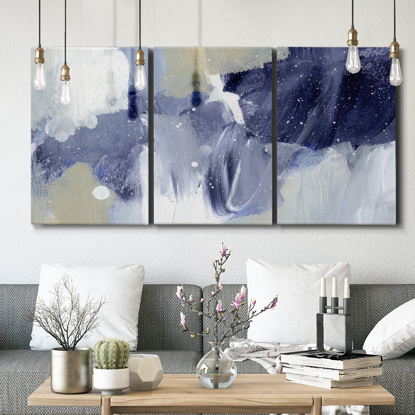 Three-panel canvas wall art featuring abstract sky break composition, displayed in a modern living room above seating.
