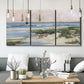 Three-panel canvas wall art featuring soft morning light over calm sea, displayed in a modern living room above seating.
