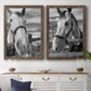 Set of two walnut barnwood framed canvas prints depicting a coordinated art pair of black-and-white close-up portraits of horses at fences rendered as modern equestrian photography above a dining room sideboard.