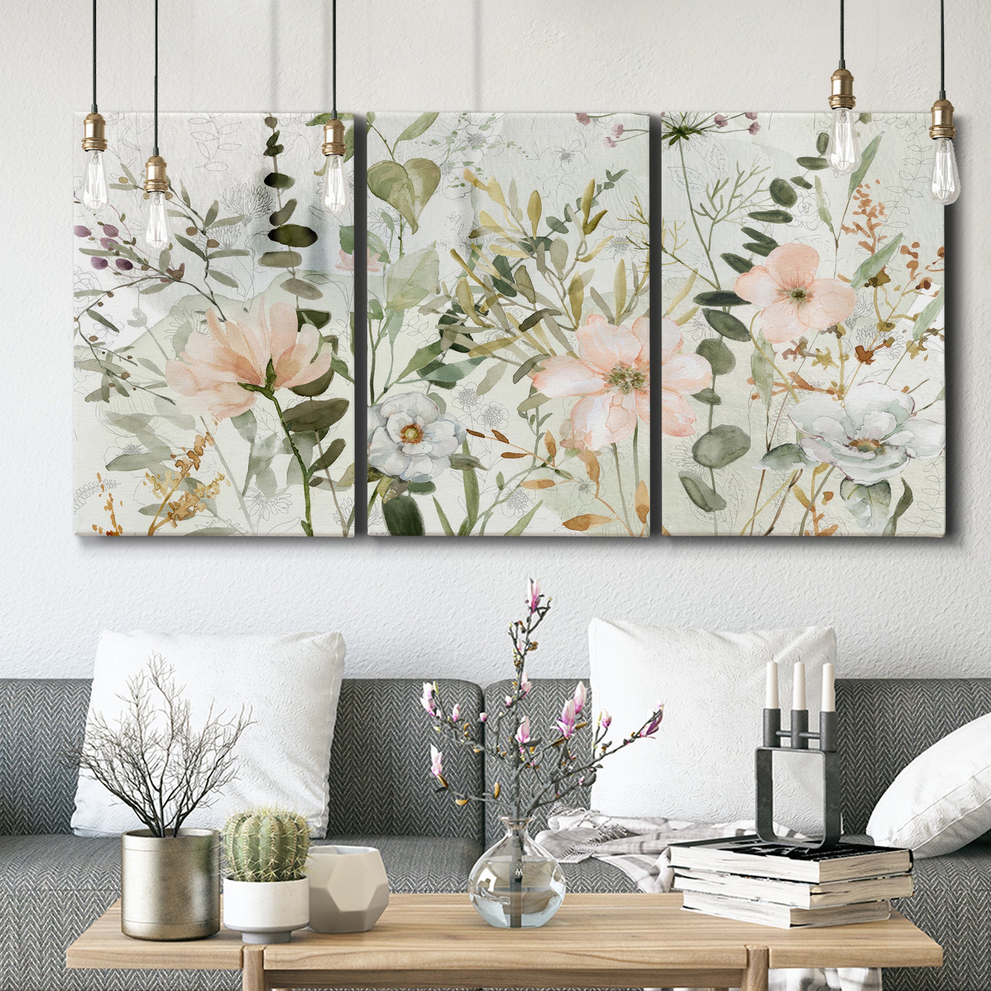 Three-panel canvas wall art featuring vintage floral botanical sketchbook, displayed in a modern living room above seating.