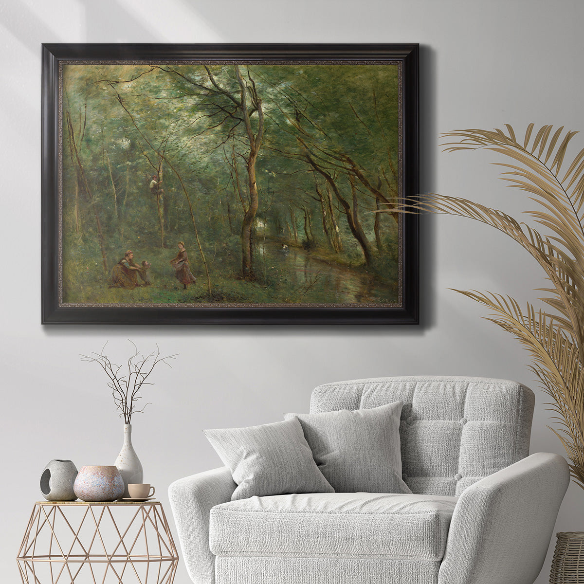 Traditional rural landscape scene with figures by Jean-Baptiste-Camille Corot in an ornate black frame with gilded inner detail displayed in a bright interior setting.