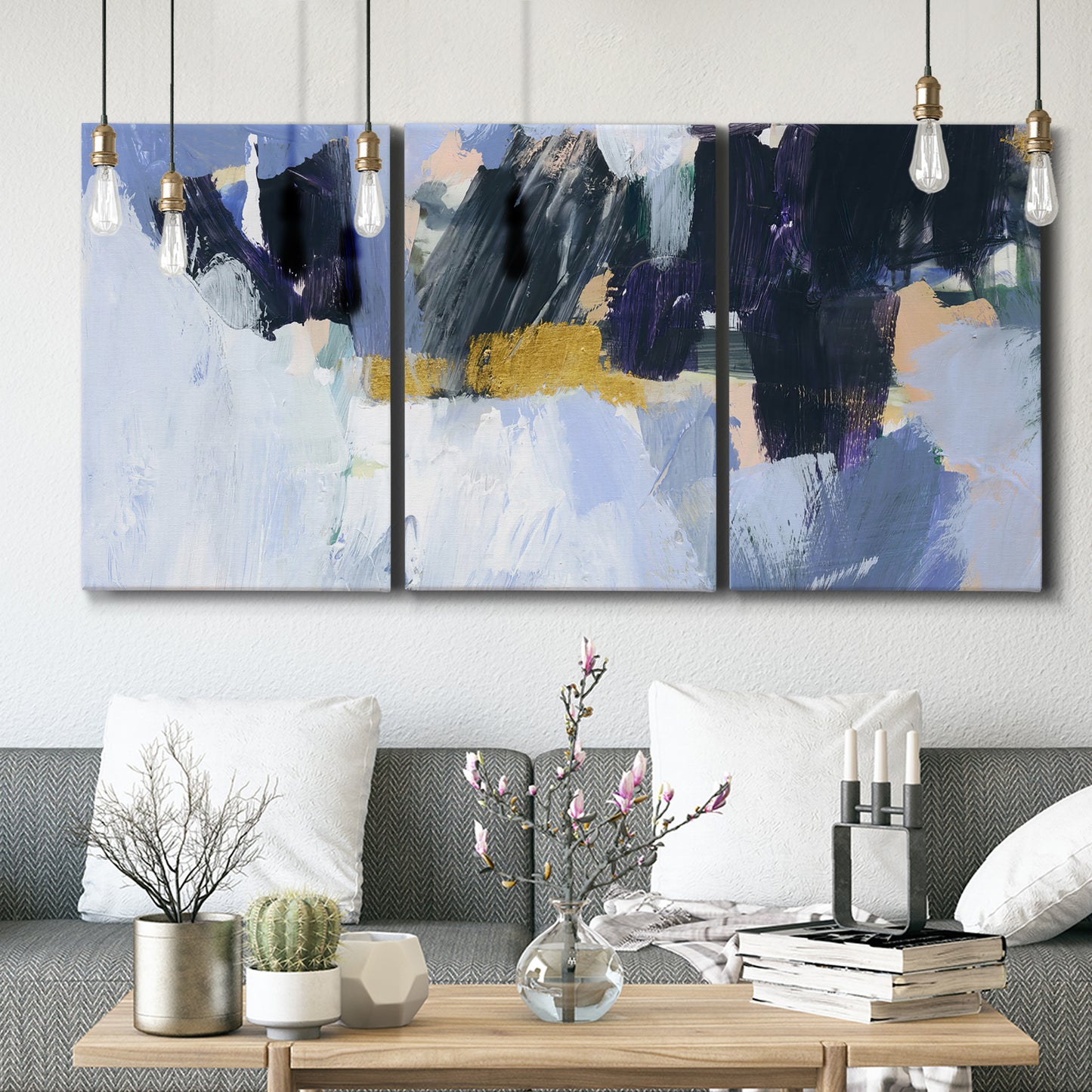 Three-panel canvas wall art featuring icy abstract arctic ledge, displayed in a modern living room above seating.