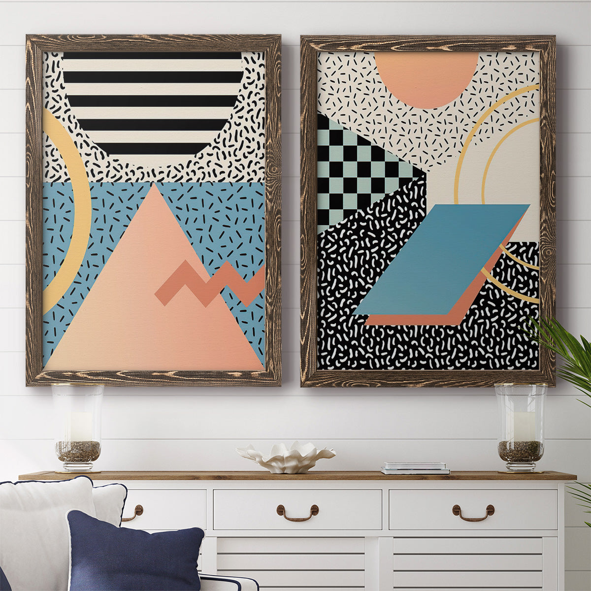Set of two walnut barnwood framed canvas prints depicting a coordinated art pair of bold geometric Memphis-style patterns rendered as retro graphic abstracts above a dining room sideboard.