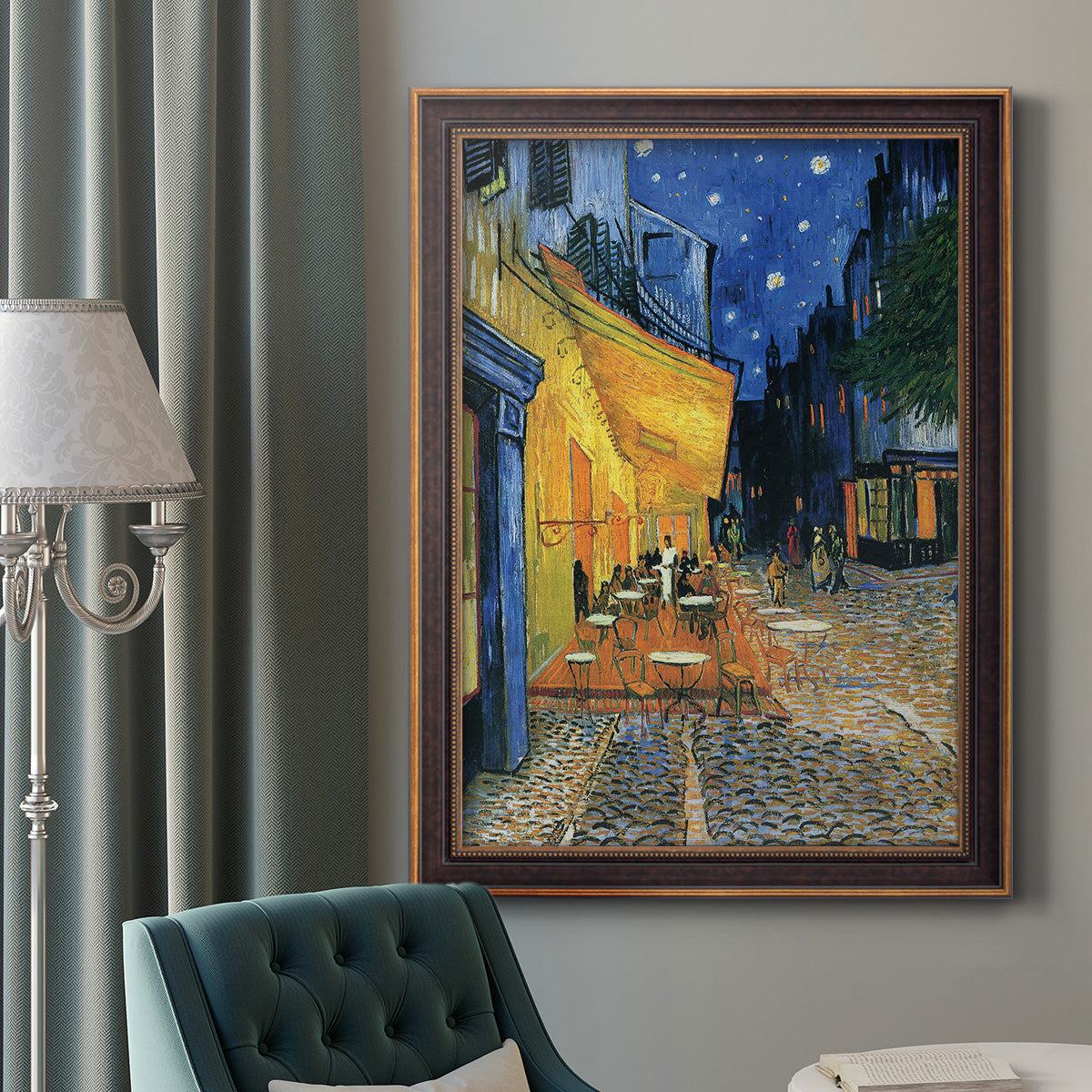 Impressionist night café street scene by Vincent van Gogh in an ornate bronzed mahogany wood frame displayed in a dark-toned interior setting.