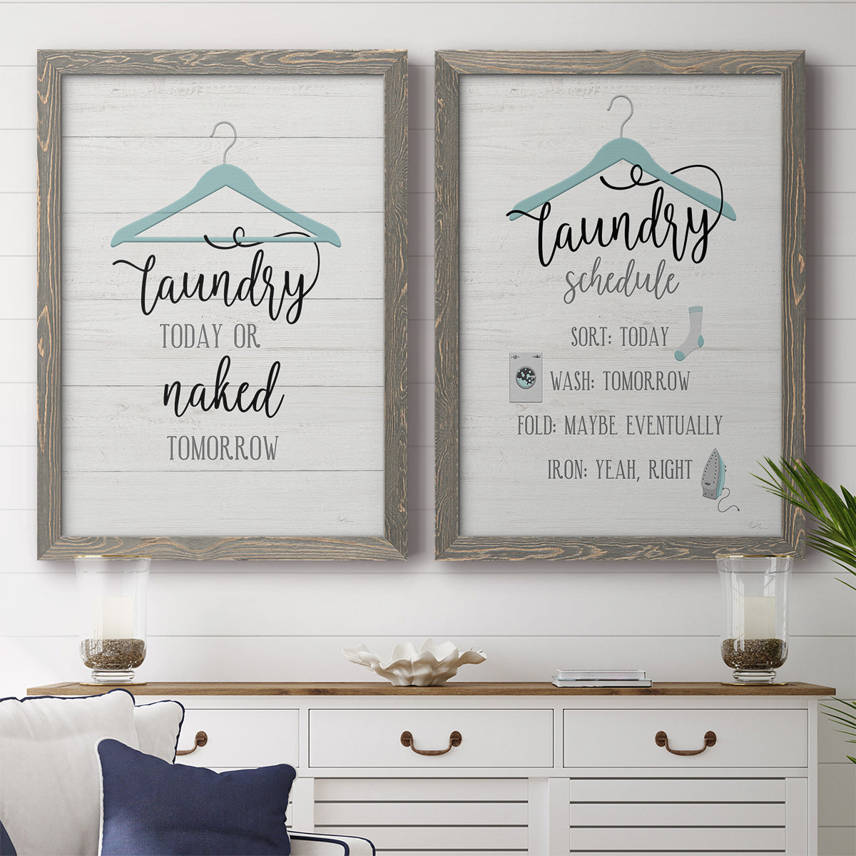 Set of two gray barnwood framed canvas prints depicting a coordinated art pair of humorous laundry-room sayings and clothing icons rendered as rustic typographic wall art above a dining room sideboard.