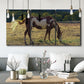 Three-panel canvas wall art featuring horses standing near farmhouse, displayed in a modern living room above seating.