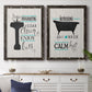 Set of two black barnwood framed canvas prints depicting a coordinated art pair of playful bathtub silhouettes and bath-themed typography rendered as graphic bathroom word art above a dining room sideboard.