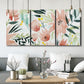 Three-panel canvas wall art featuring layered tropical plant collage, displayed in a modern living room above seating.