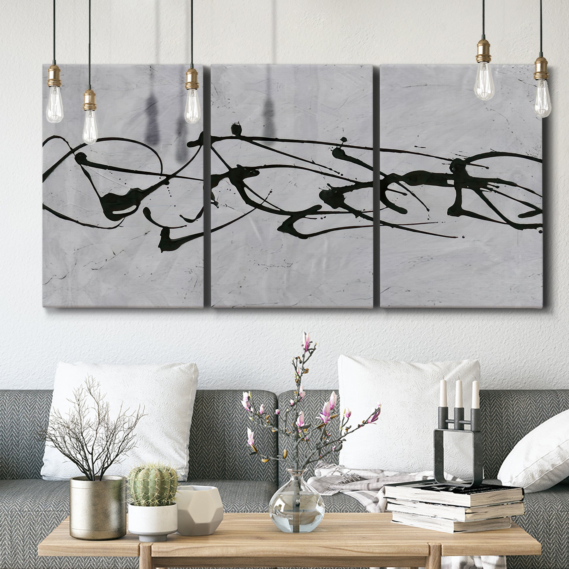 Three-panel canvas wall art featuring minimal abstract frequency lines, displayed in a modern living room above seating.