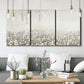 Three-panel canvas wall art featuring dark textured abstract mist, displayed in a modern living room above seating.