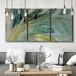 Three-panel canvas wall art featuring layered modern abstract landscape, displayed in a modern living room above seating.