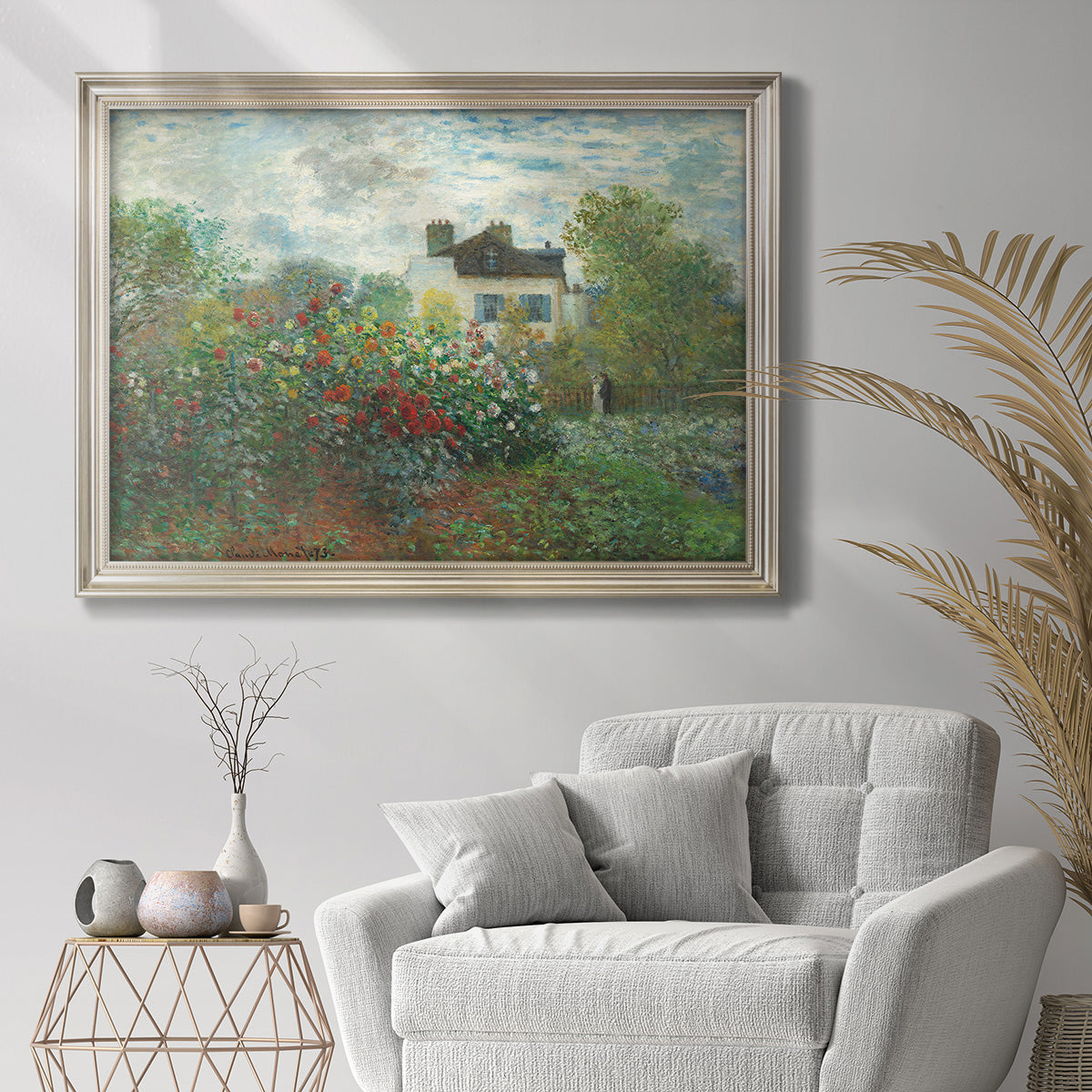 Impressionist garden landscape at Argenteuil by Claude Monet in an ornate champagne frame displayed in a bright interior setting.
