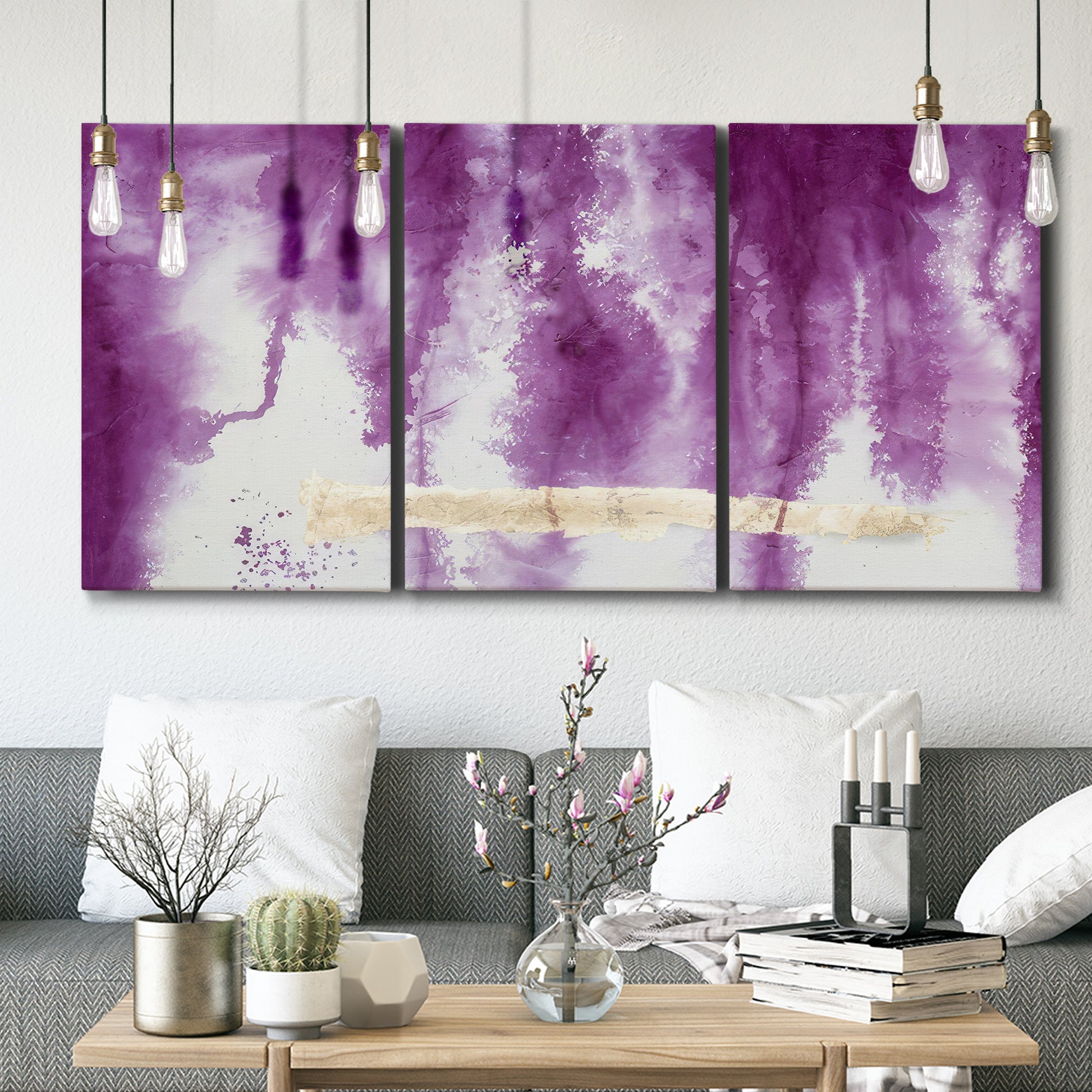 Three-panel canvas wall art featuring saturated abstract color fields, displayed in a modern living room above seating.