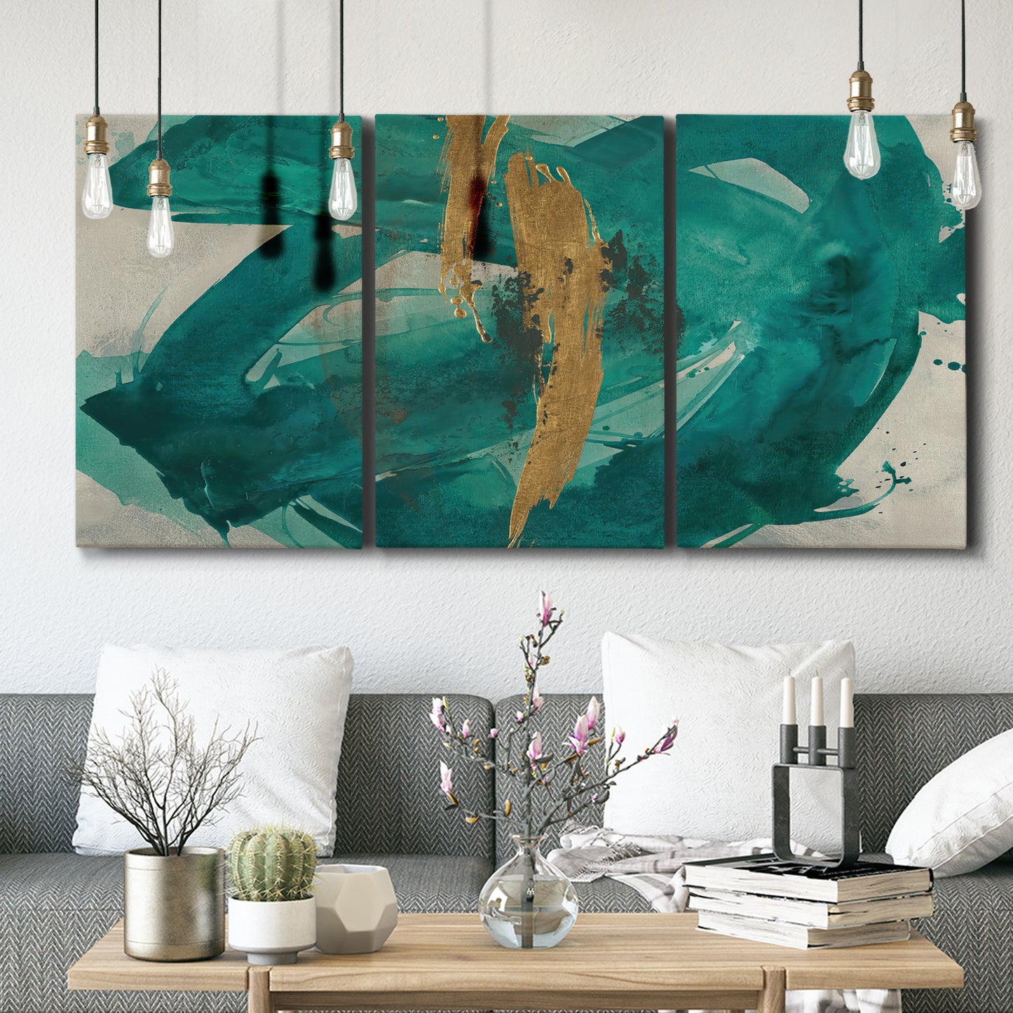 Three-panel canvas wall art featuring interconnected abstract flowing forms, displayed in a modern living room above seating.