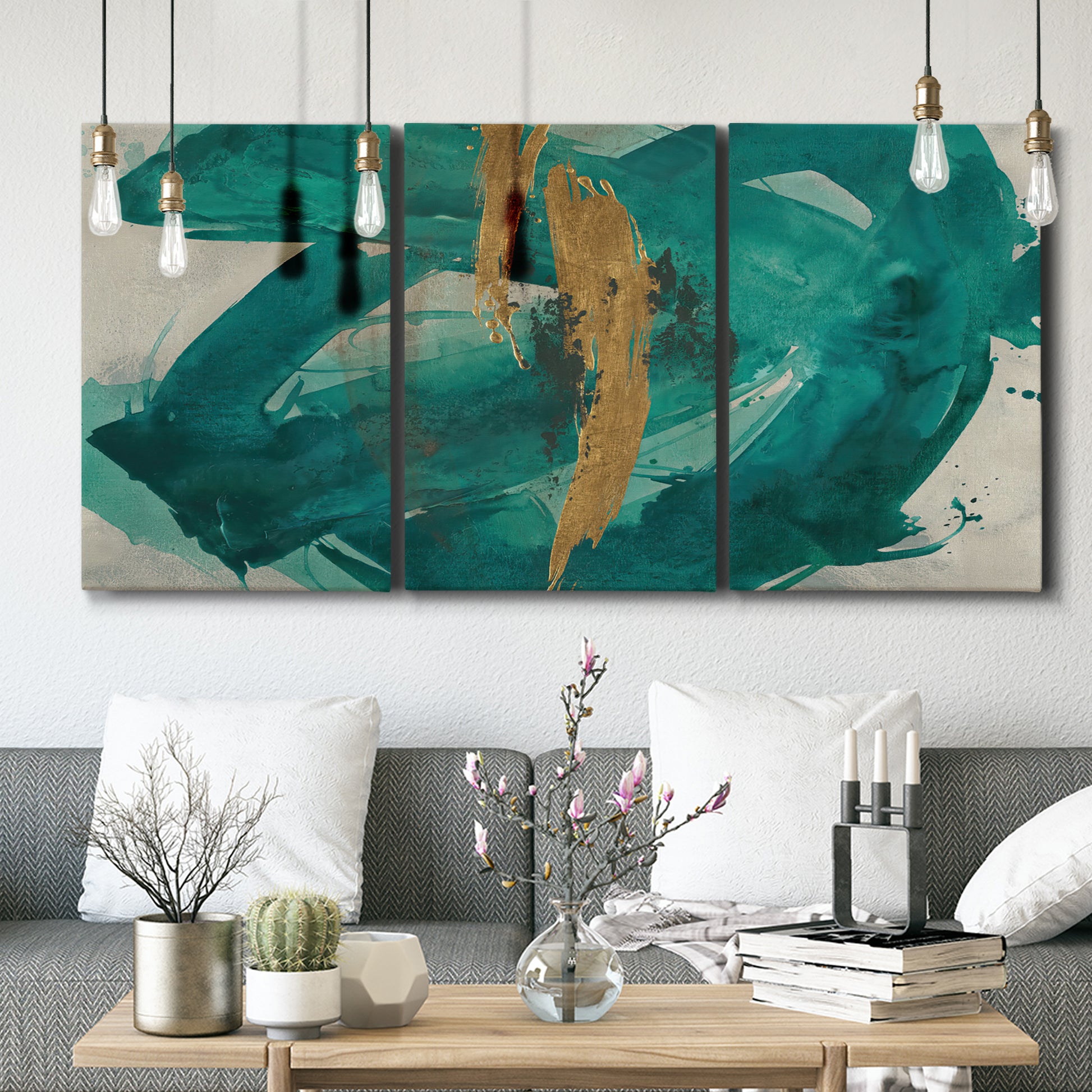 Three-panel canvas wall art featuring interconnected abstract flowing forms, displayed in a modern living room above seating.