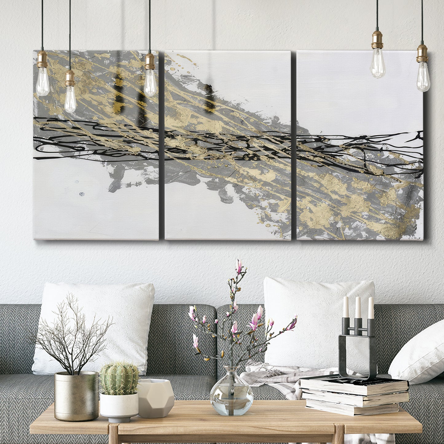 Three-panel canvas wall art featuring light modern abstract wind patterns, displayed in a modern living room above seating.