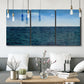 Three-panel canvas wall art featuring open water landscape with wide horizon, displayed in a modern living room above seating.