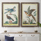 Set of two walnut barnwood framed canvas prints depicting a coordinated art pair of misty blue gray and violet marks hovering across pale grounds rendered as atmospheric abstract paintings above a dining room sideboard.