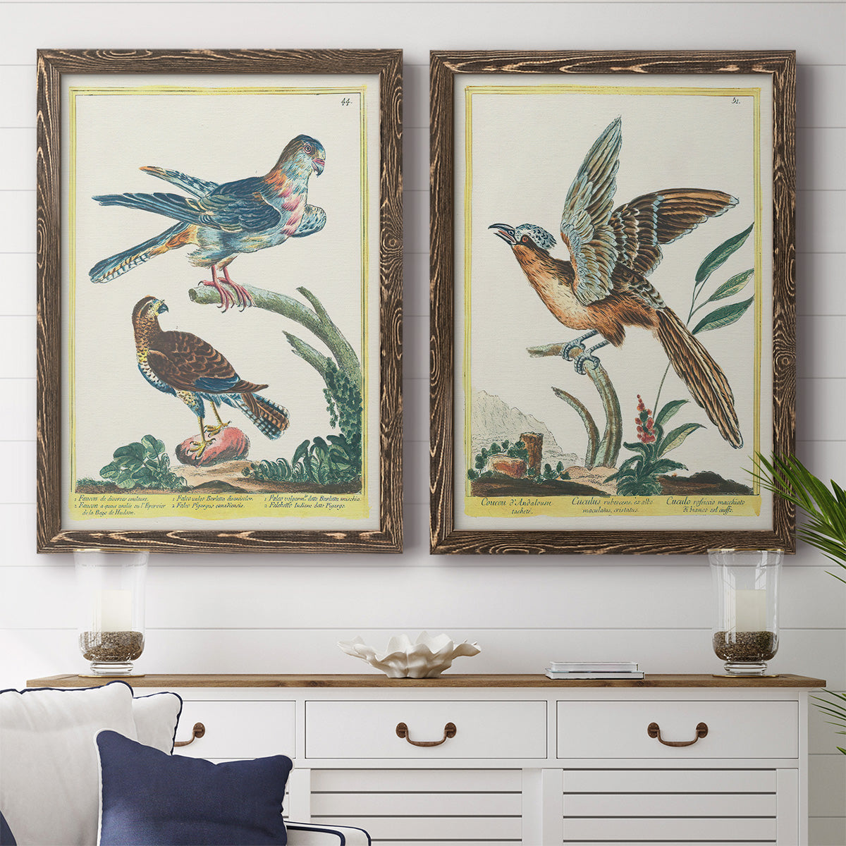 Set of two walnut barnwood framed canvas prints depicting a coordinated art pair of misty blue gray and violet marks hovering across pale grounds rendered as atmospheric abstract paintings above a dining room sideboard.