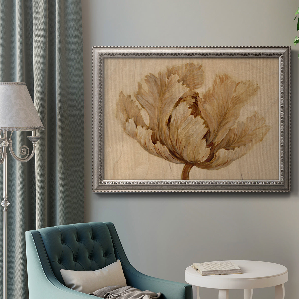 Minimalist sepia tulip botanical artwork in an ornate vintage silver frame displayed in a neutral interior setting.