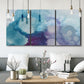 Three-panel canvas wall art featuring icy abstract crystalline forms, displayed in a modern living room above seating.