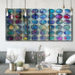 Three-panel canvas wall art featuring contrasting geometric abstract variations, displayed in a modern living room above seating.