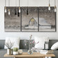 Three-panel canvas wall art featuring rustic winter holiday text art, displayed in a modern living room above seating.