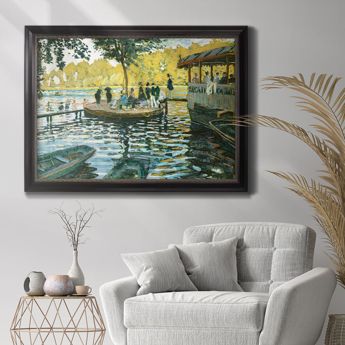 Impressionist riverside leisure scene by Claude Monet in an ornate black frame with gilded inner detail displayed in a bright interior setting.