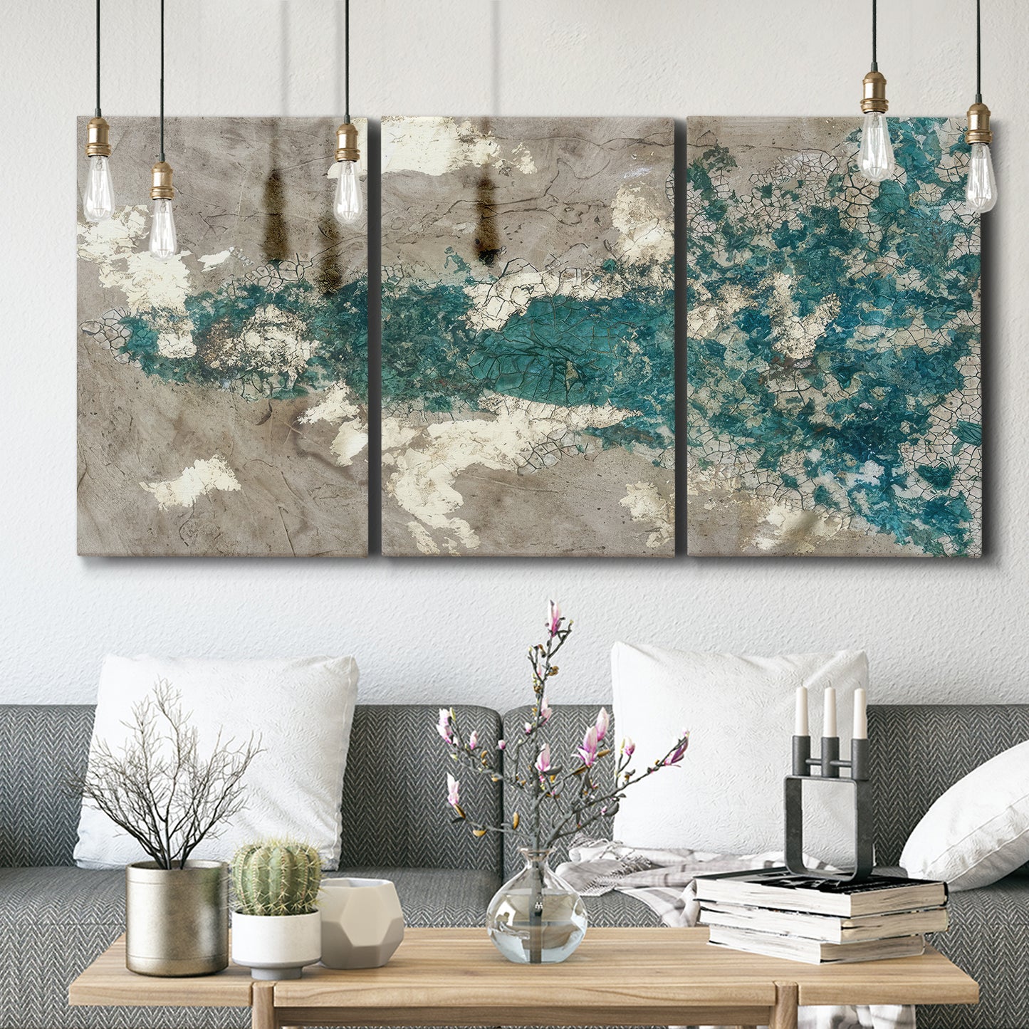 Three-panel canvas wall art featuring layered mineral abstract textures, displayed in a modern living room above seating.