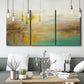 Three-panel canvas wall art featuring warm abstract end of summer palette, displayed in a modern living room above seating.