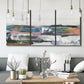 Three-panel canvas wall art featuring cheerful abstract coastal seascape, displayed in a modern living room above seating.