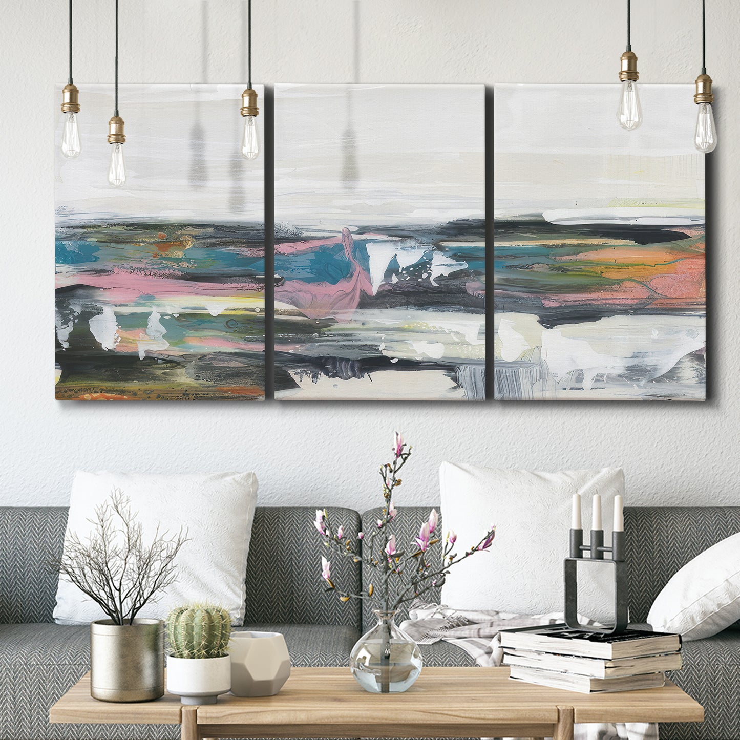Three-panel canvas wall art featuring cheerful abstract coastal seascape, displayed in a modern living room above seating.